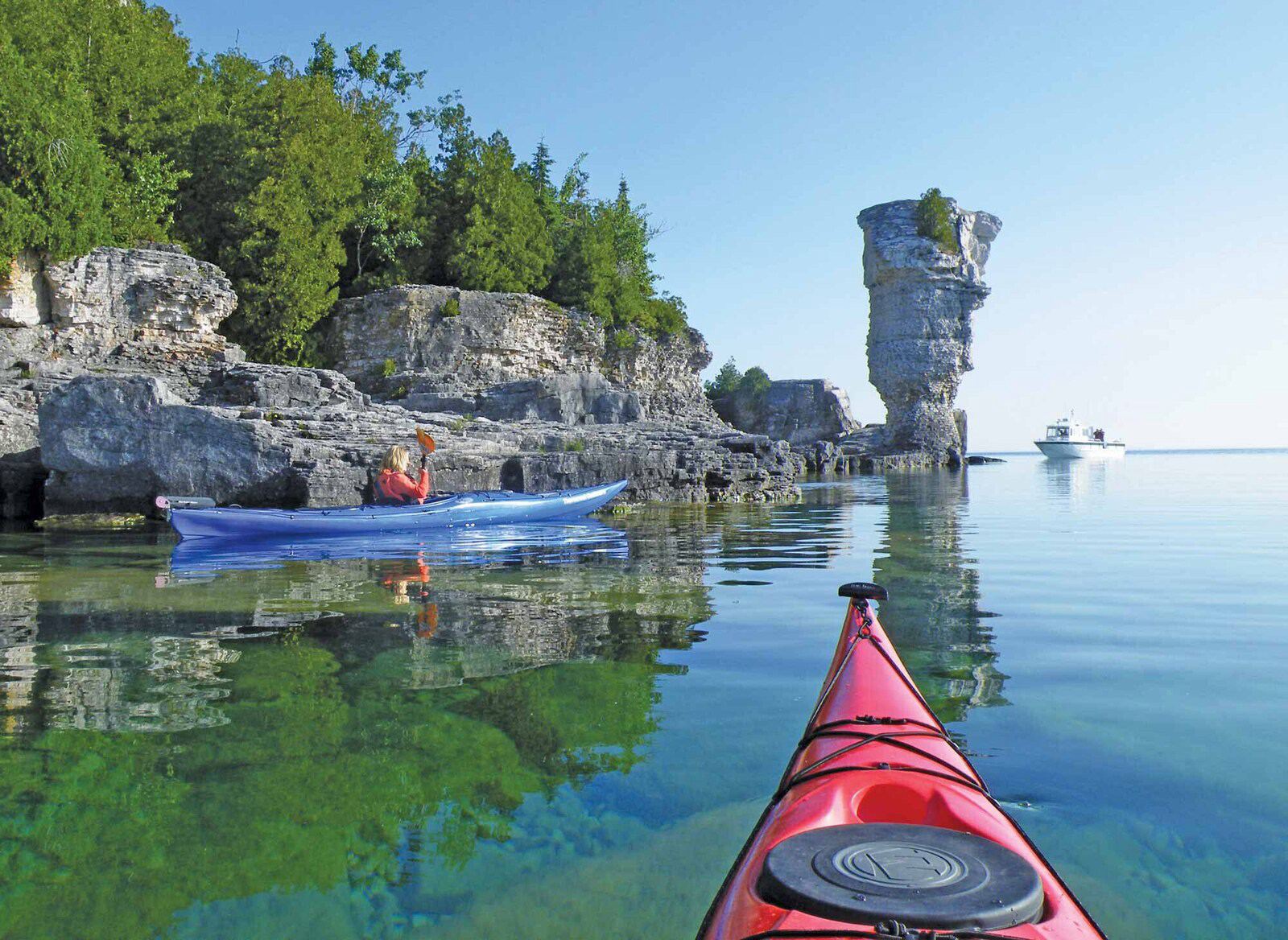 Kayaking past the flowerpot rock formations nearby