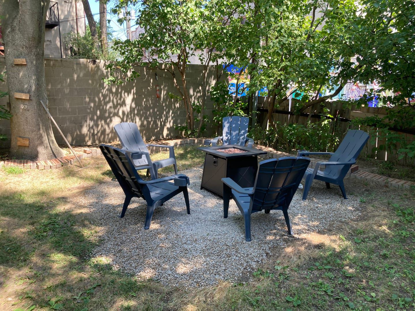 Backyard seating under the trees