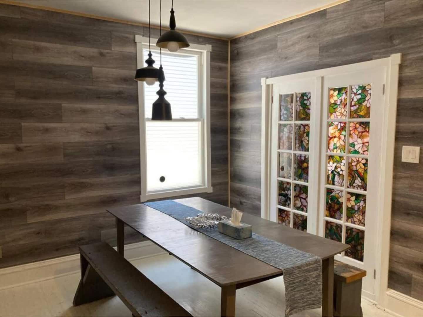 Dining room with reclaimed-wood walls
